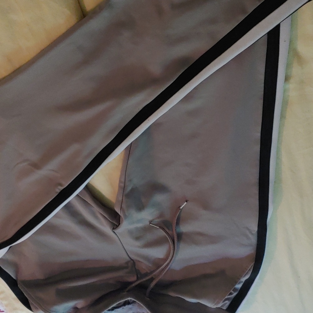 ASOS Active pants. Grey straight legs. Black white stripes on the side. Size Med